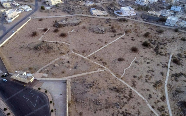An image of the historic Battle of Badar site, with open fields and a cemetery, marking the place where Prophet Muhammad (PBUH) and his companions triumphed.
